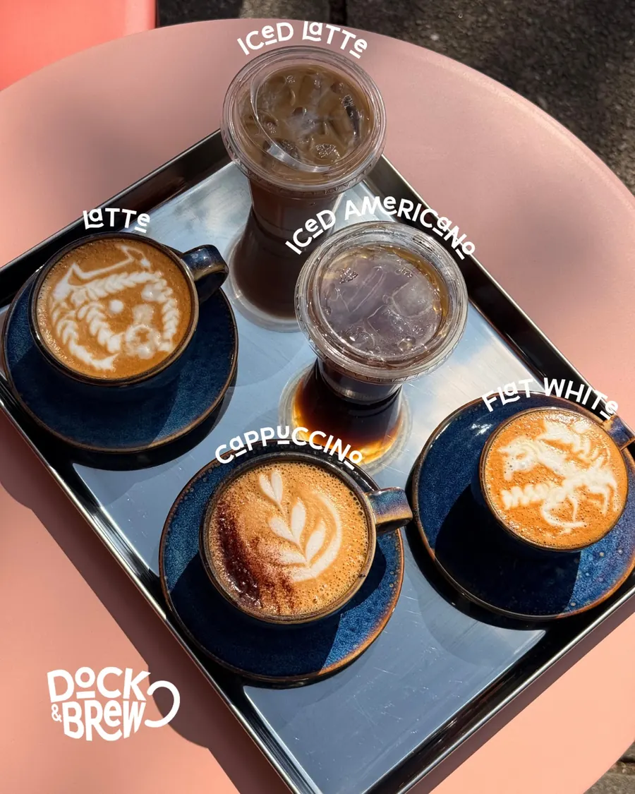 Coffees with latte art on a tray